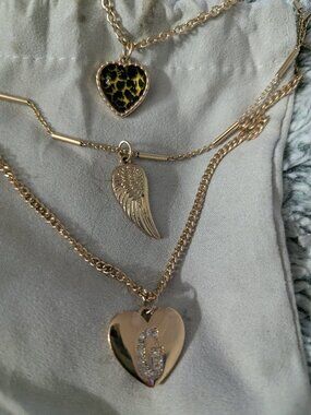 GUESS Triple Layering Necklace with Hearts and Angel Wing Gold Tone